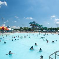 Guests enjoying the sunshine while floating in the wave pool