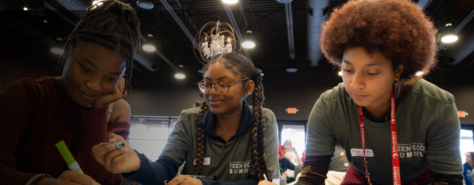 three teens working on project