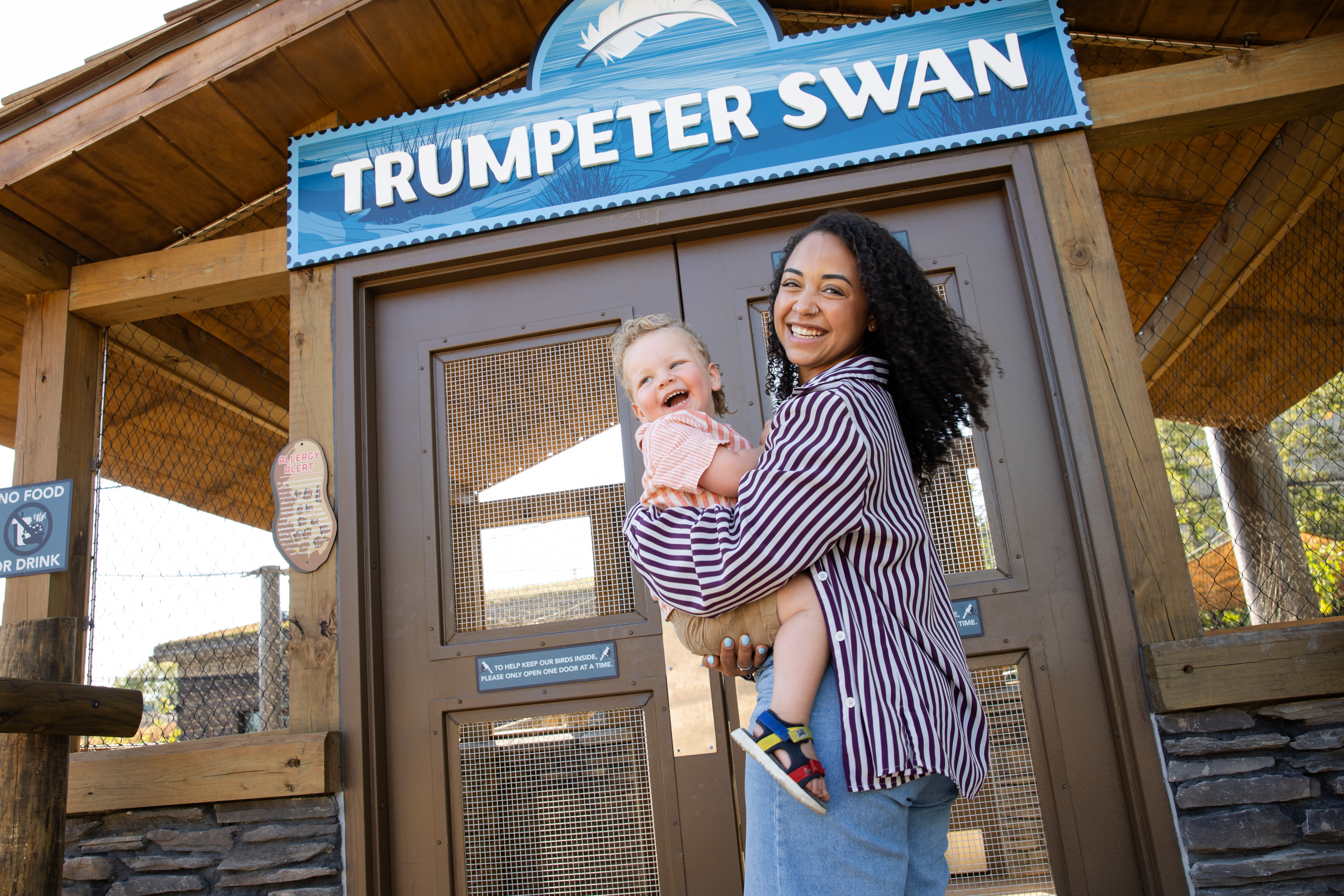 woman and baby posing for photo at the columbus zoo