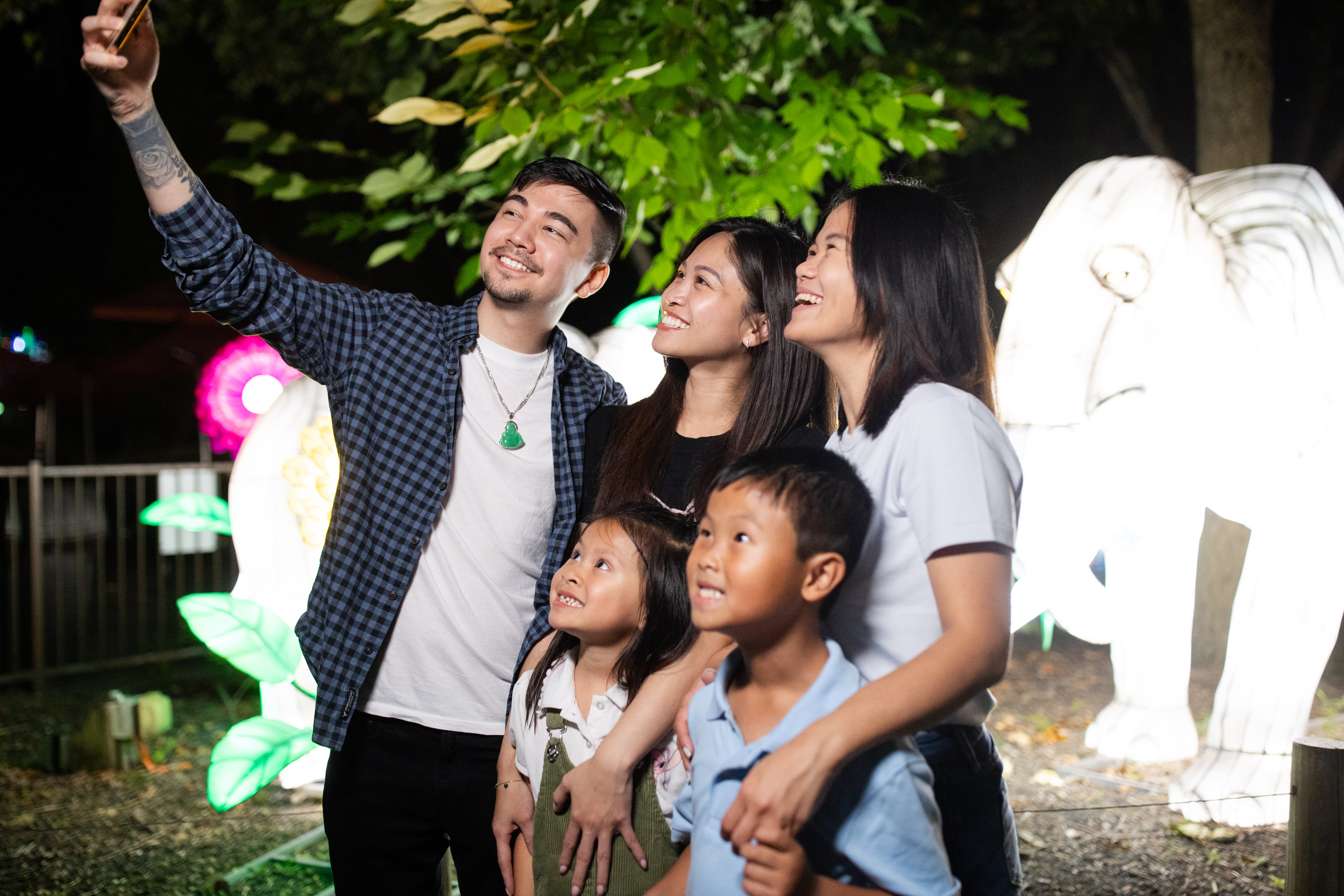 Family taking selfie with elephant lanterns