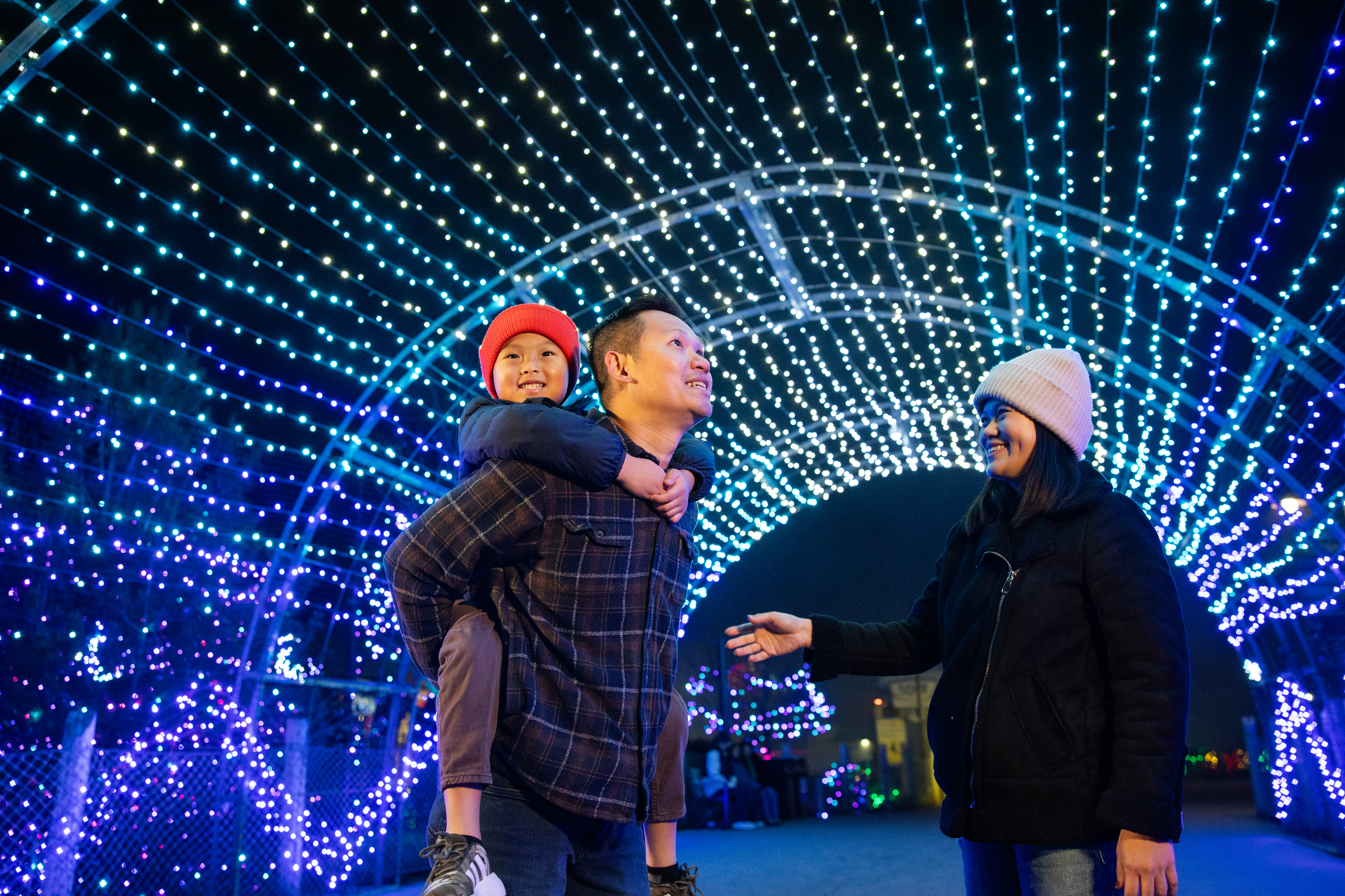 family under light tunnel at the Columbus Zoo