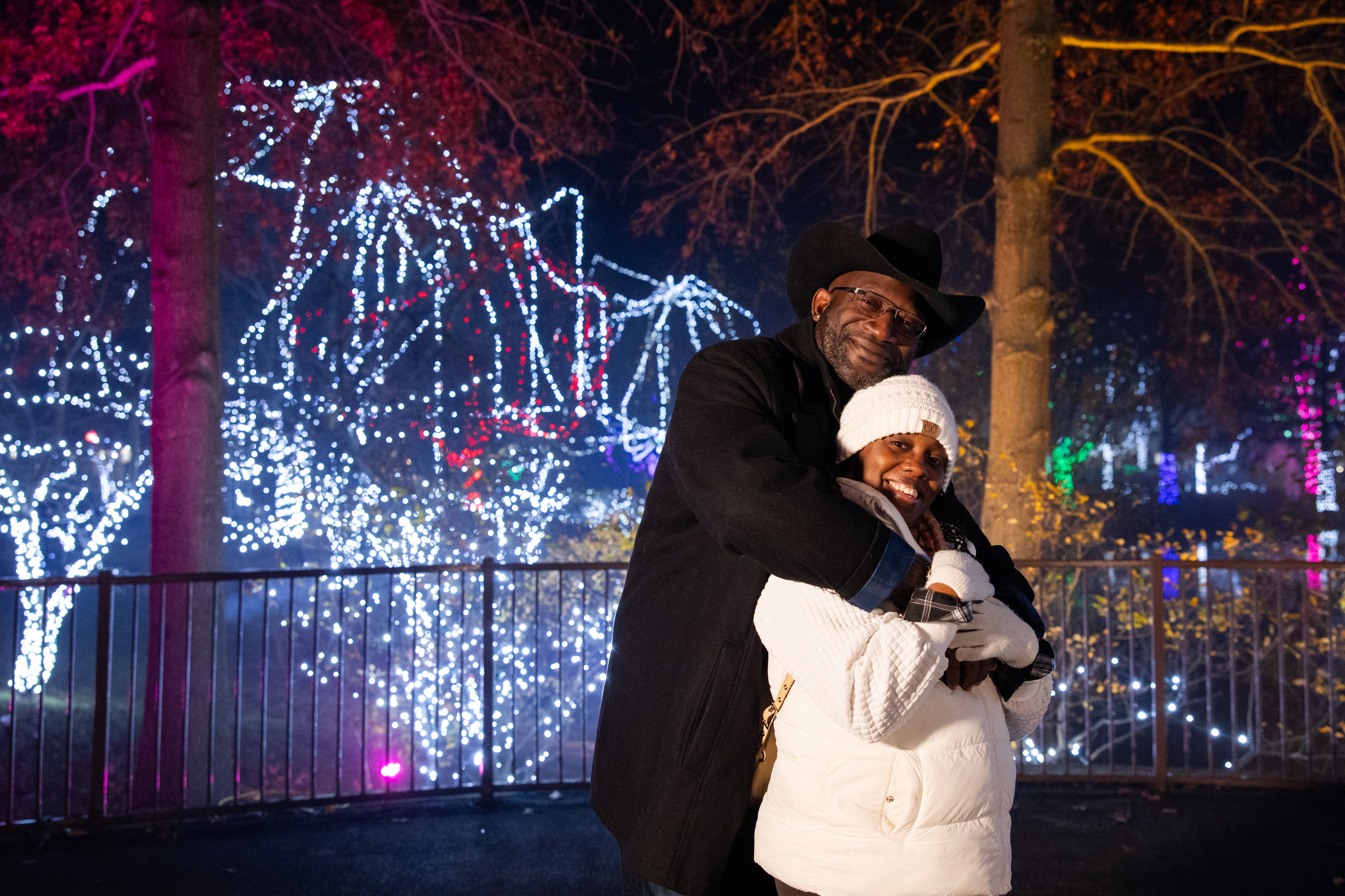 Couple posing at outdoor holiday event
