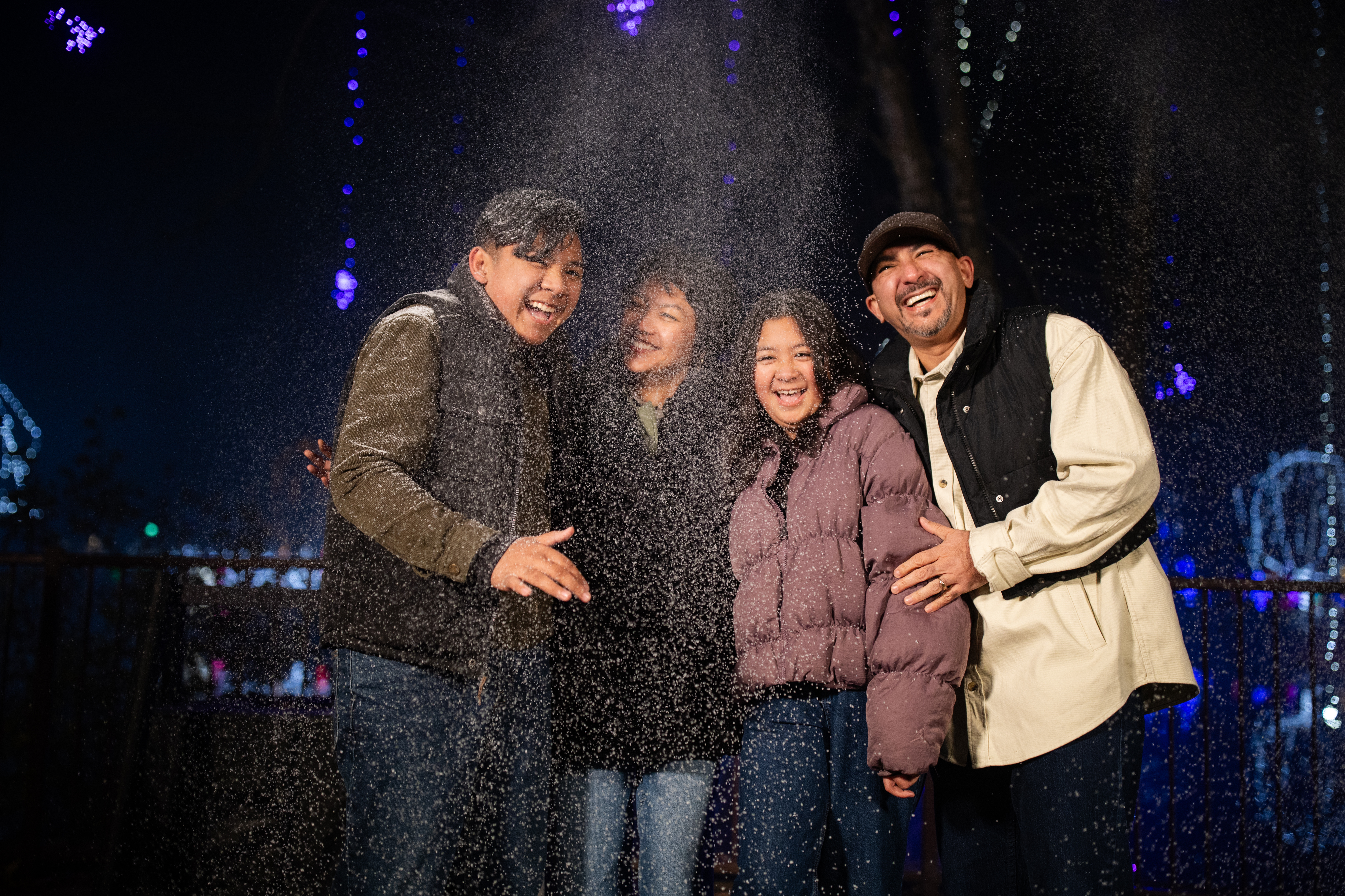 four people posing for photo