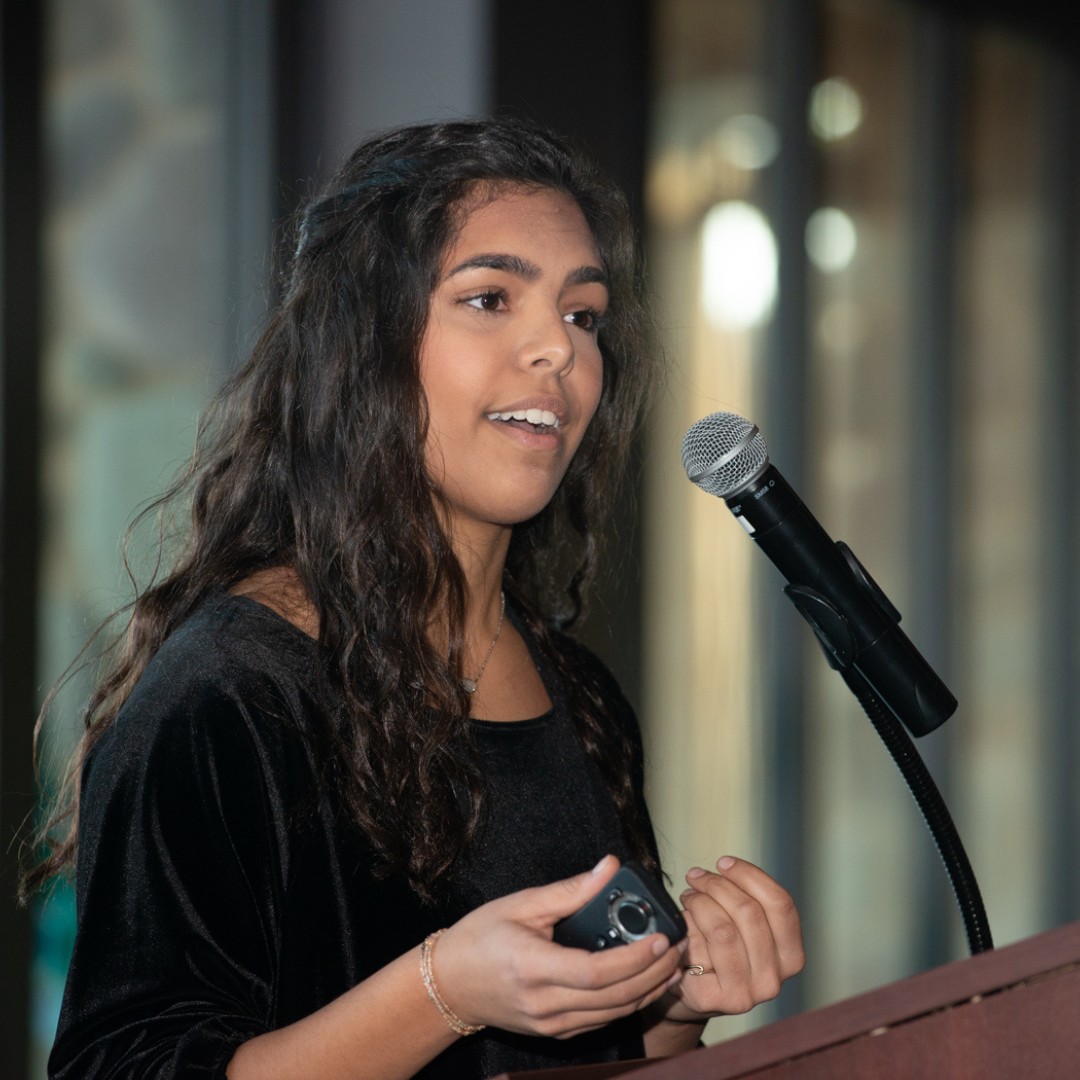 woman speaking into microphone