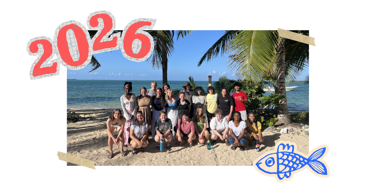 students posing for photo on beach