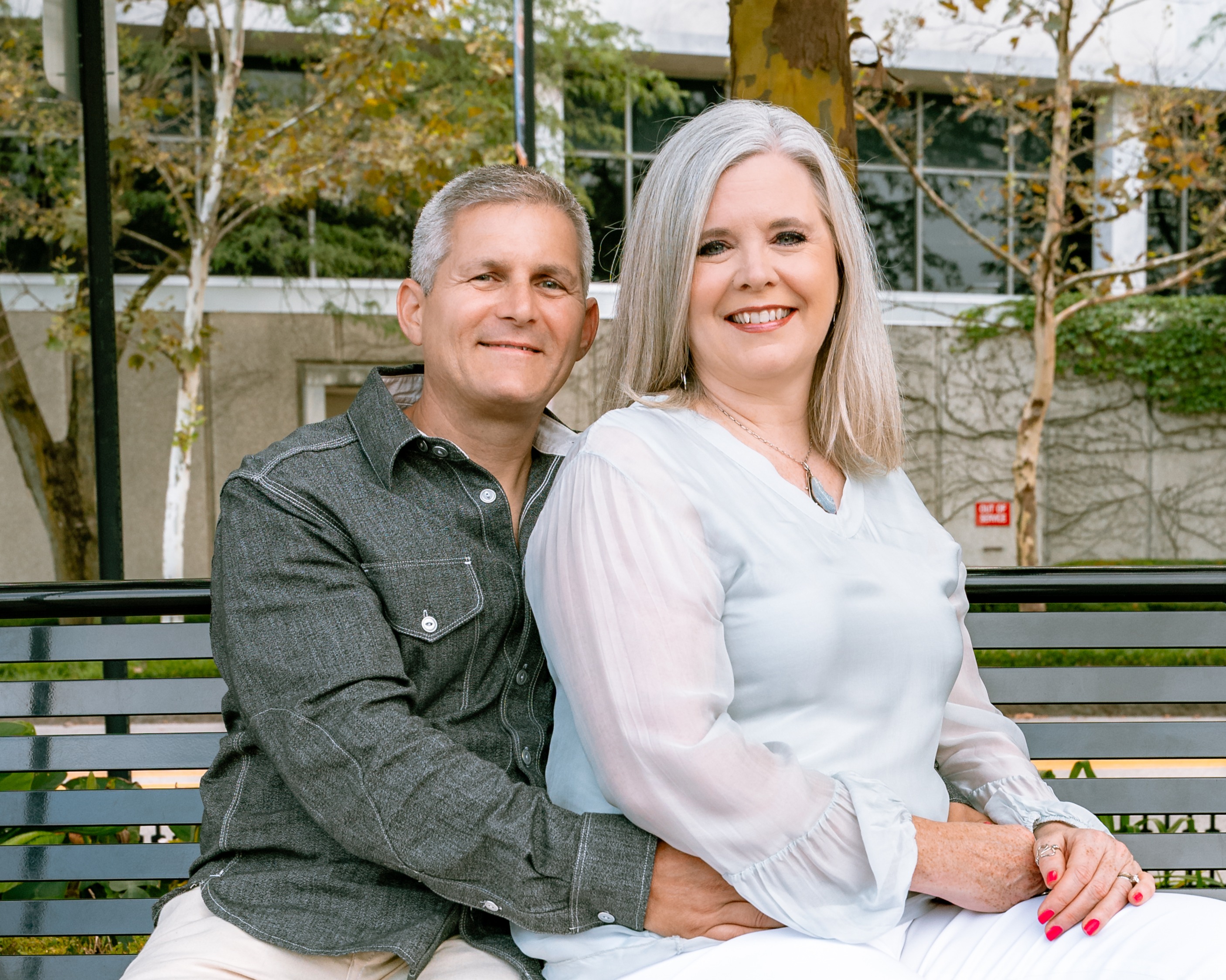 couple sitting together on bench