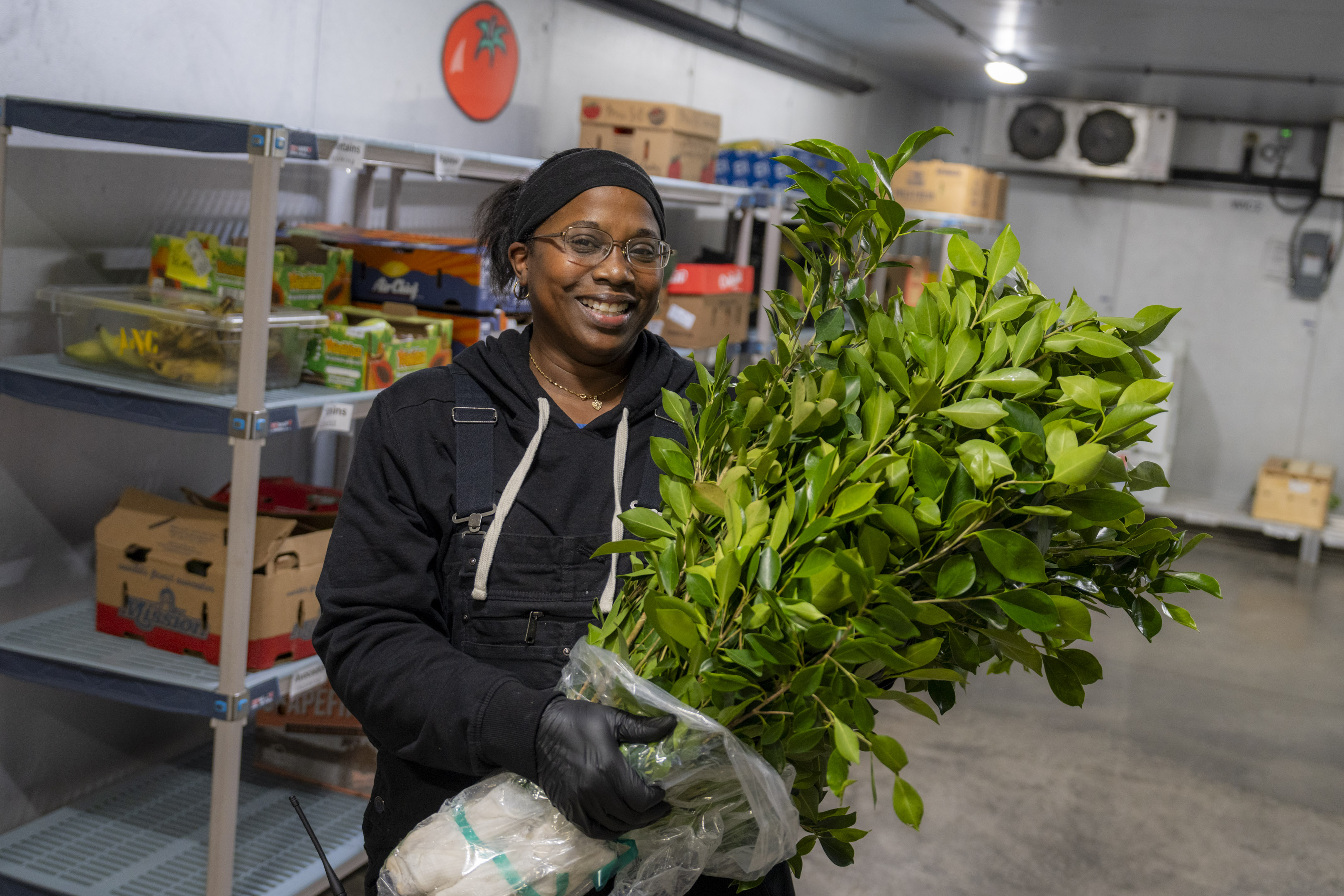 Zoo employee holding a bushel of branches