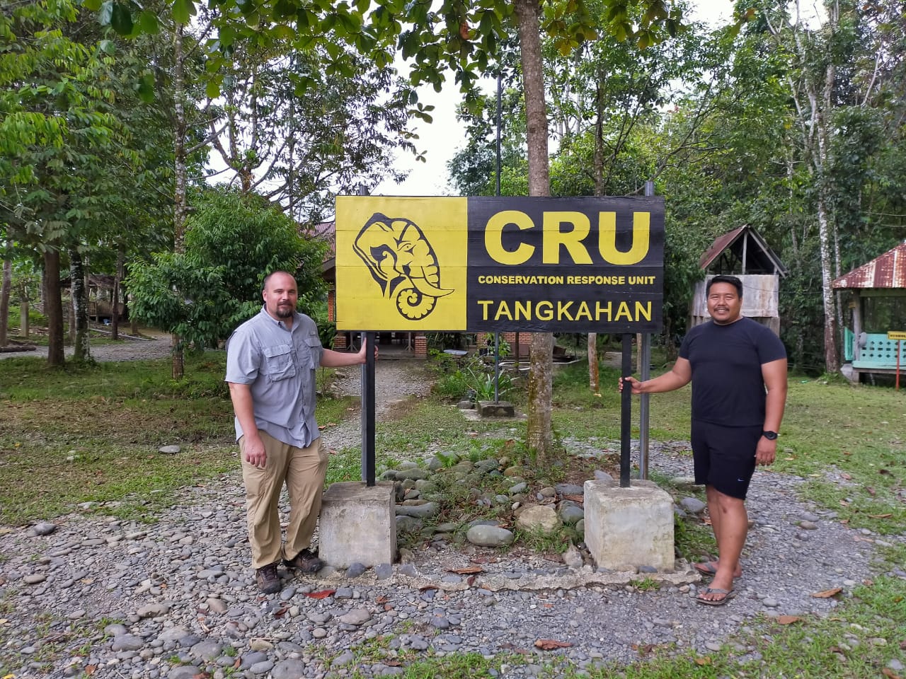 two men by sign in Sumatra