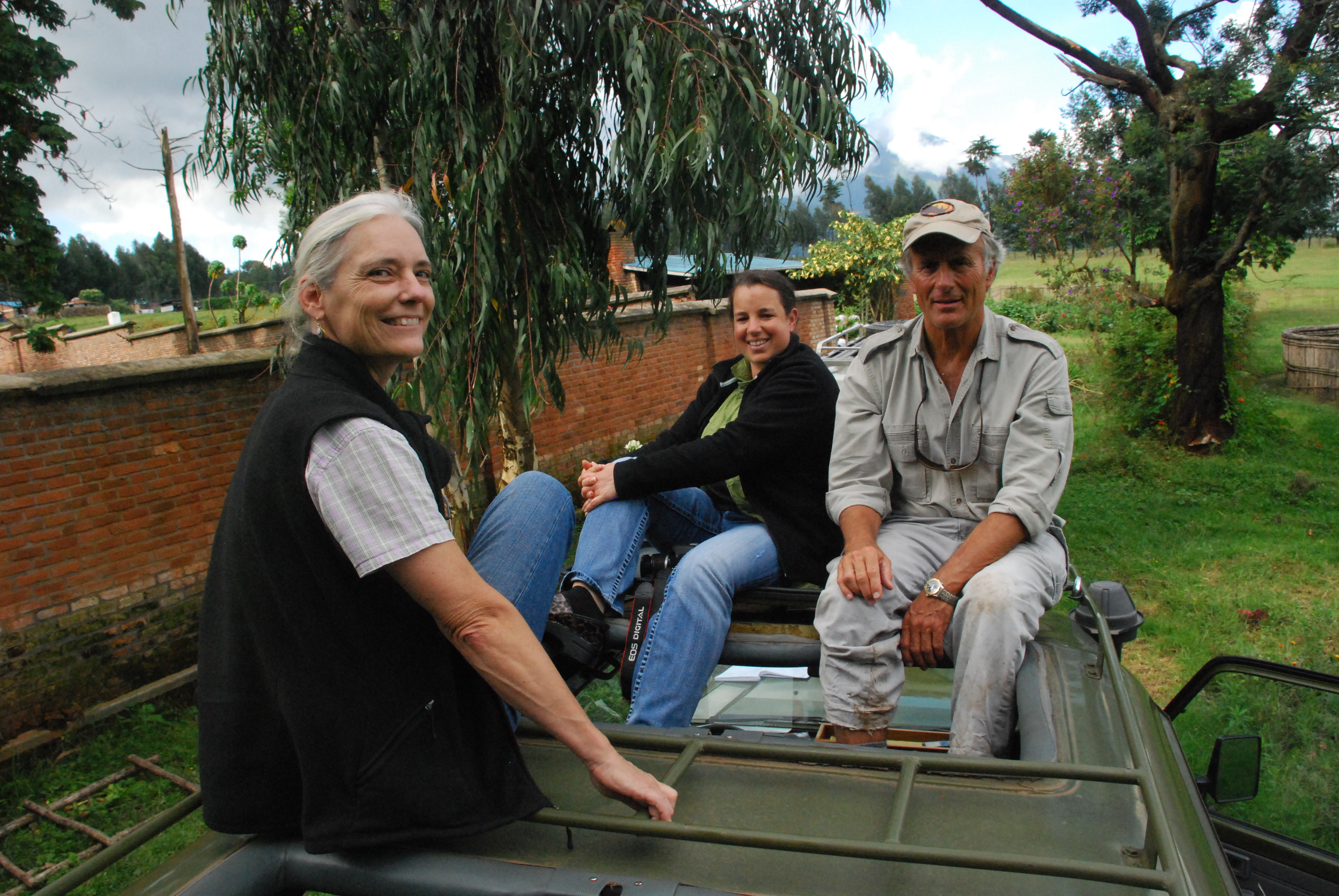 three people smiling at camera