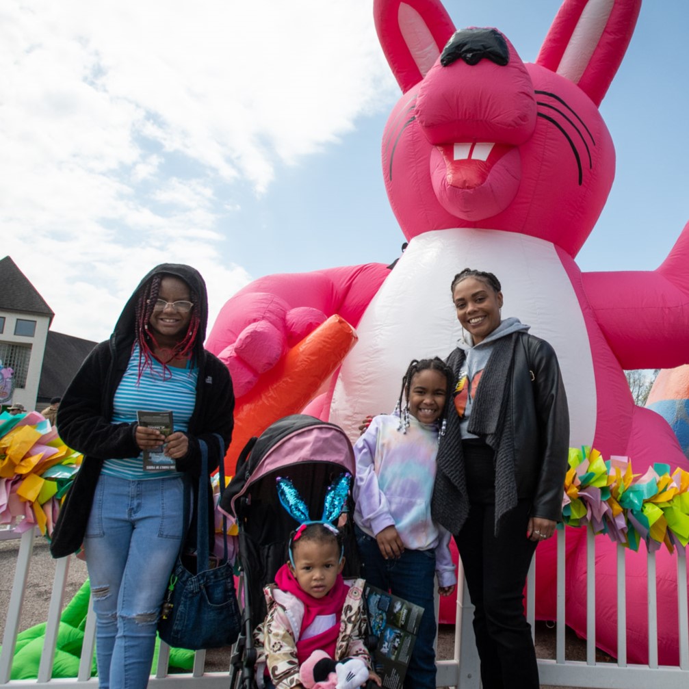 family with inflatable bunny decoration