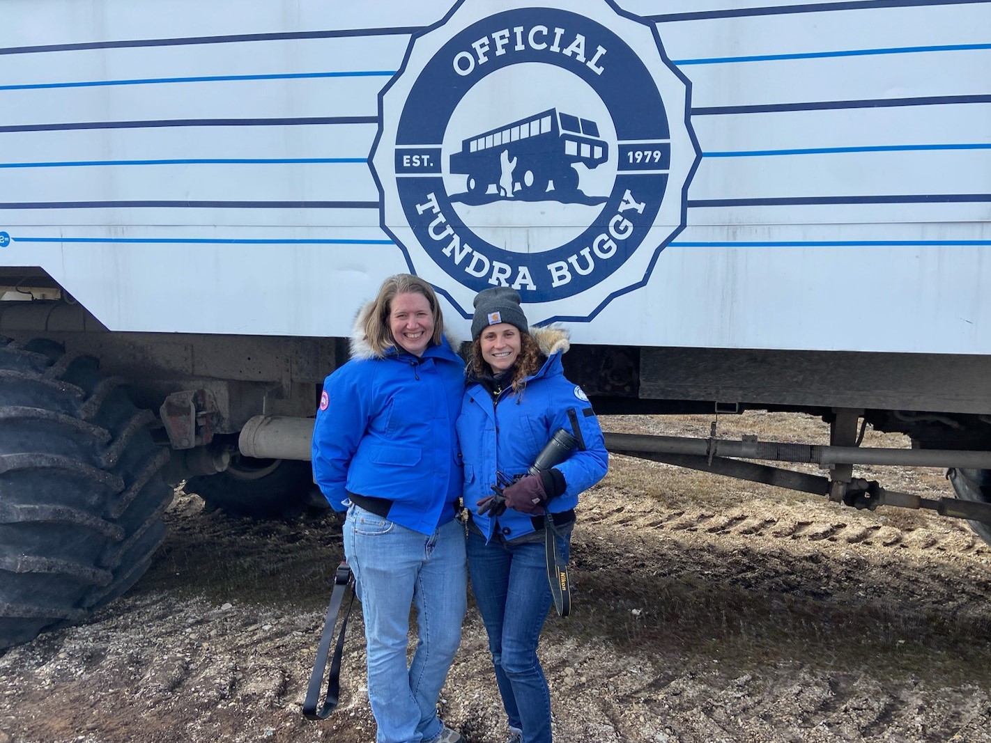 two zoo employees by tundra buggy