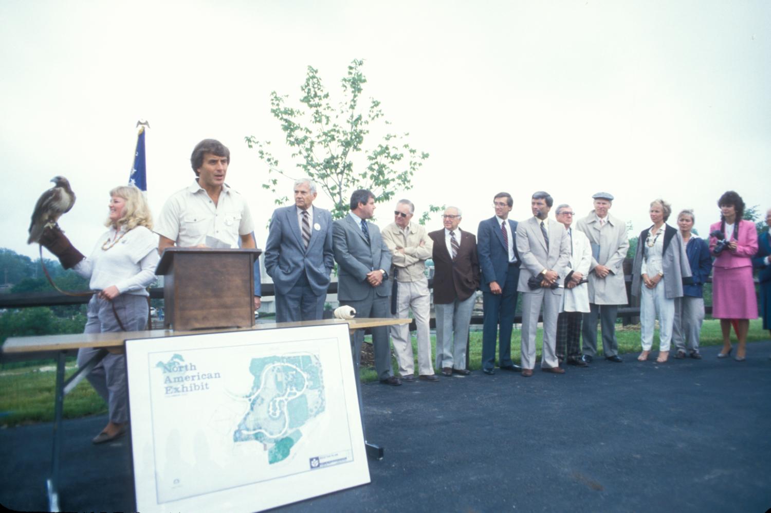 men and women standing by podium