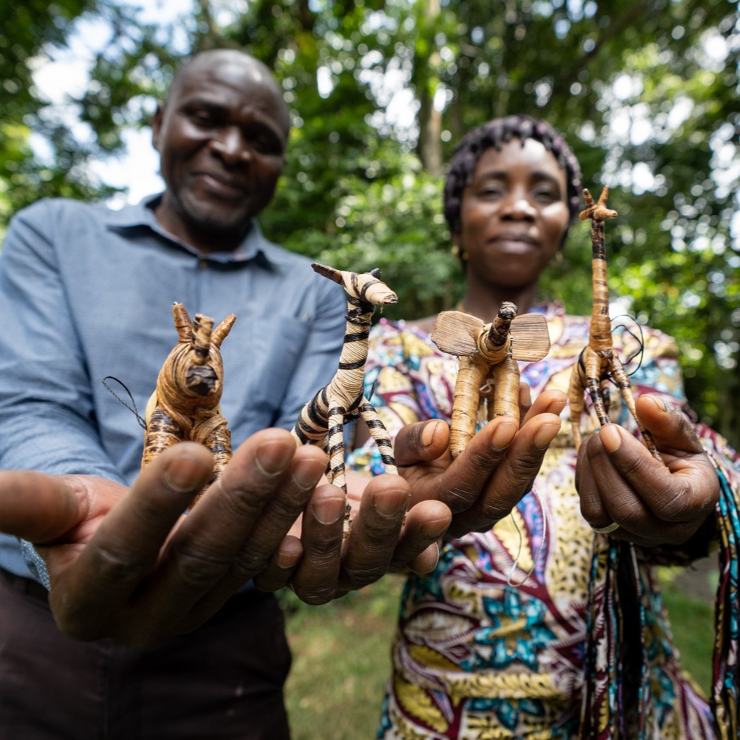 man and woman holding handmade gifts