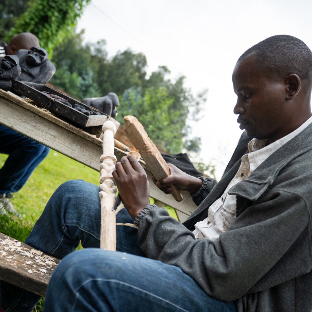 man carving item