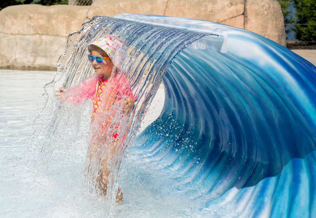 child in water feature