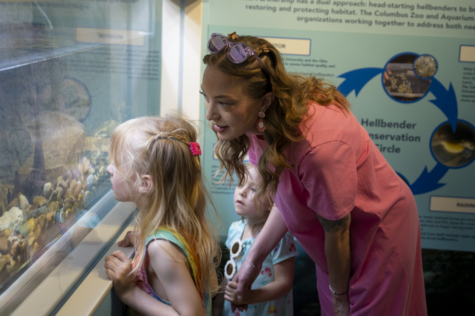 family looking in aquarium