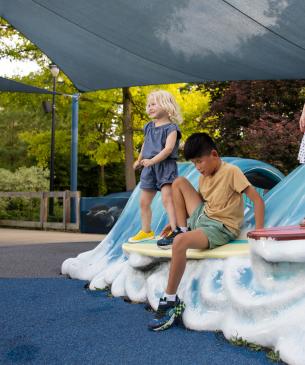 children on play equipment