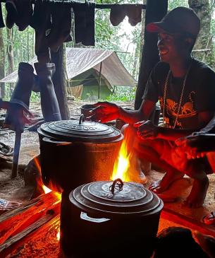 team cooking in forest