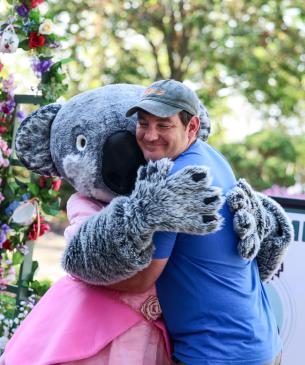 mascot hugging employee