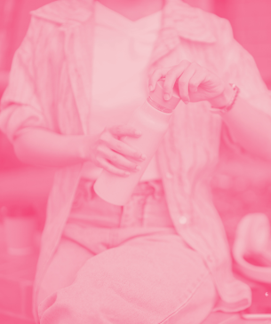 person holding water bottle