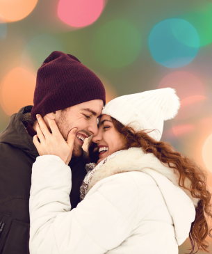 couple smiling and canoodling