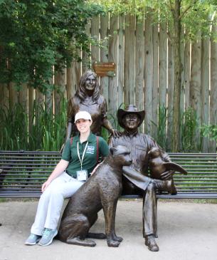 woman and statue on bench