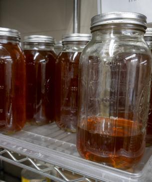 jars of brown liquid