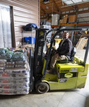 forklift holding pallets of food