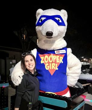 woman posing with mascot