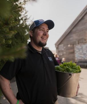 zoo team member holding feed bucket