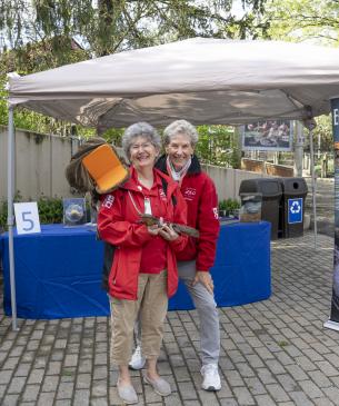 two volunteers pose for photo
