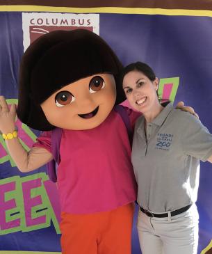 woman posing with Dora the Explorer mascot