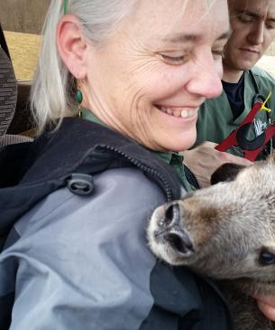 woman holding animal