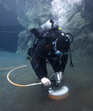 diver with scrubber underwater
