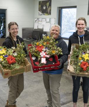 team members posing with food