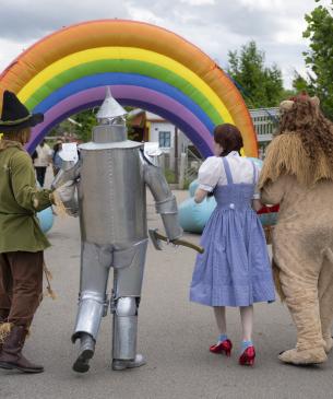 OZ cast walking away from camera