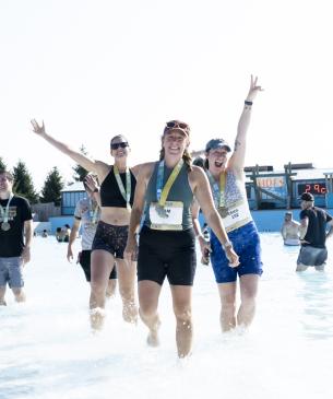 runners in shallow water