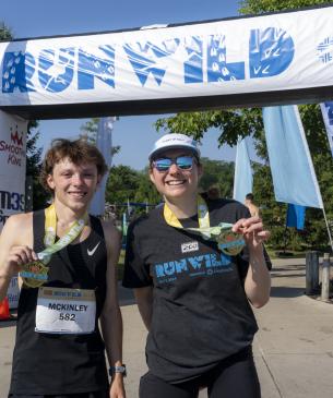 runners smiling for photo