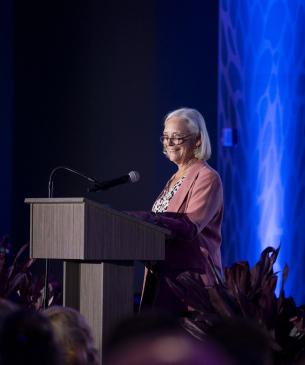 person speaking at podium at Columbus Zoo event