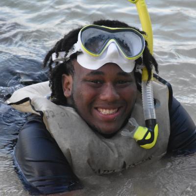 student in ocean