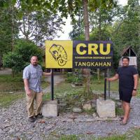 two men next to sign