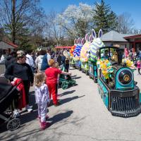 Character Ambassadors wave at guests from train