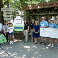 Salazar Family unveils name "Pico" on egg cutout with Zoo and Fifth Third teams 