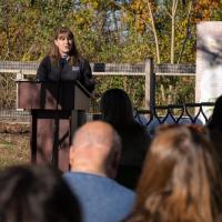 Zoo curator speaking at podium