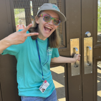 person posing for photo while opening door