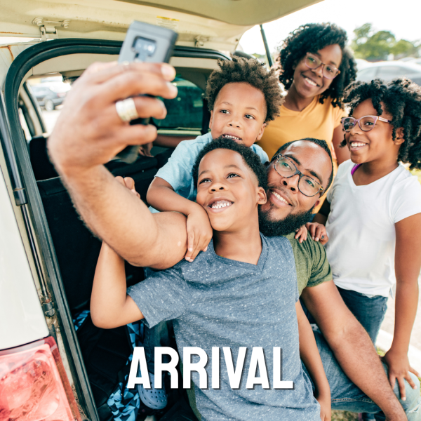 family taking selfie by car