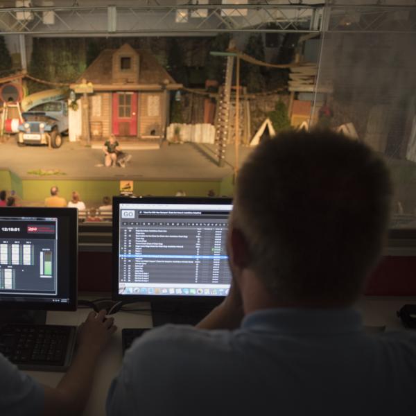 Two team members watching monitors