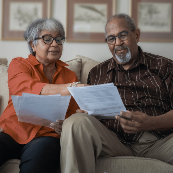 couple holding donation papers