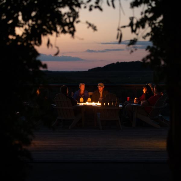 guests around fireplace at The Wilds