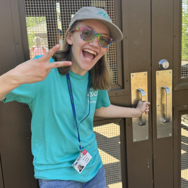 person posing for photo while opening door